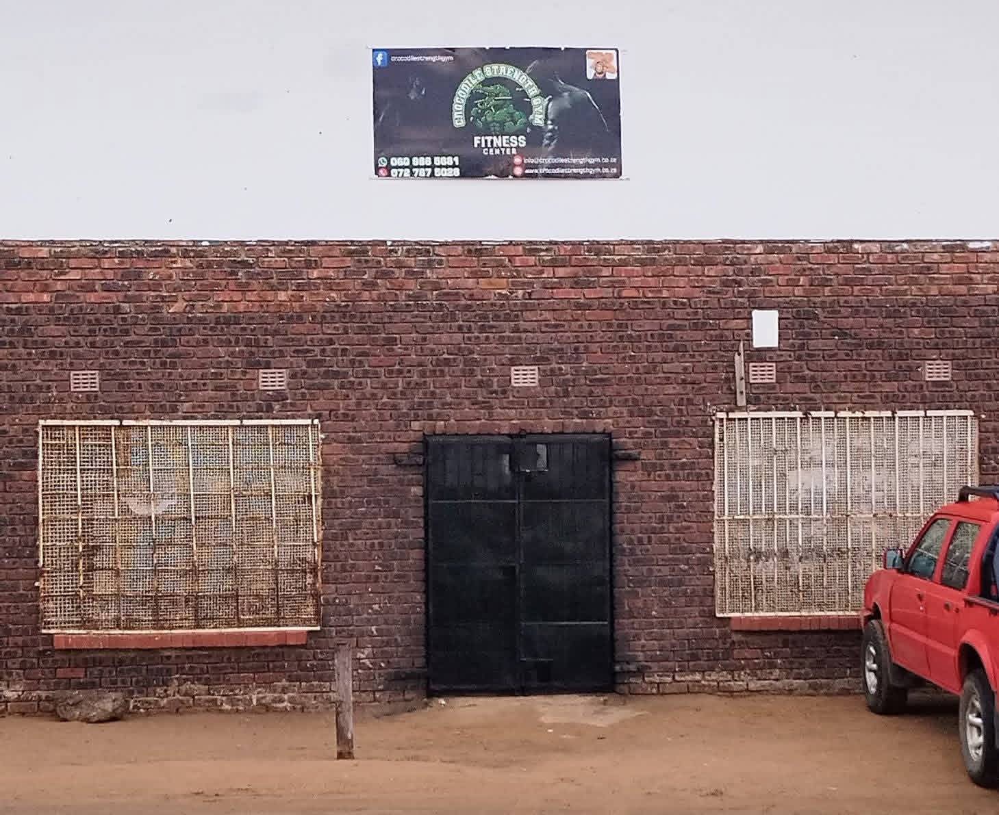 Crocodile Strength Gym exterior – brick wall and signage